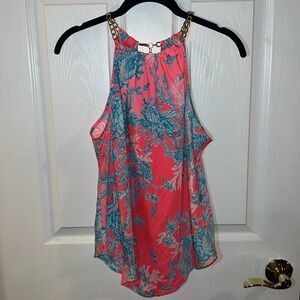Lilly Pulitzer top with gold chain detail around neck line.